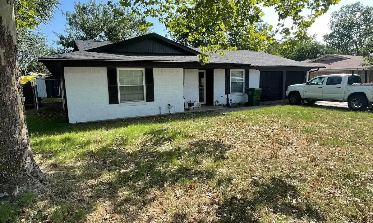 Professional roofing crew working on a residential roof in Kingsbury